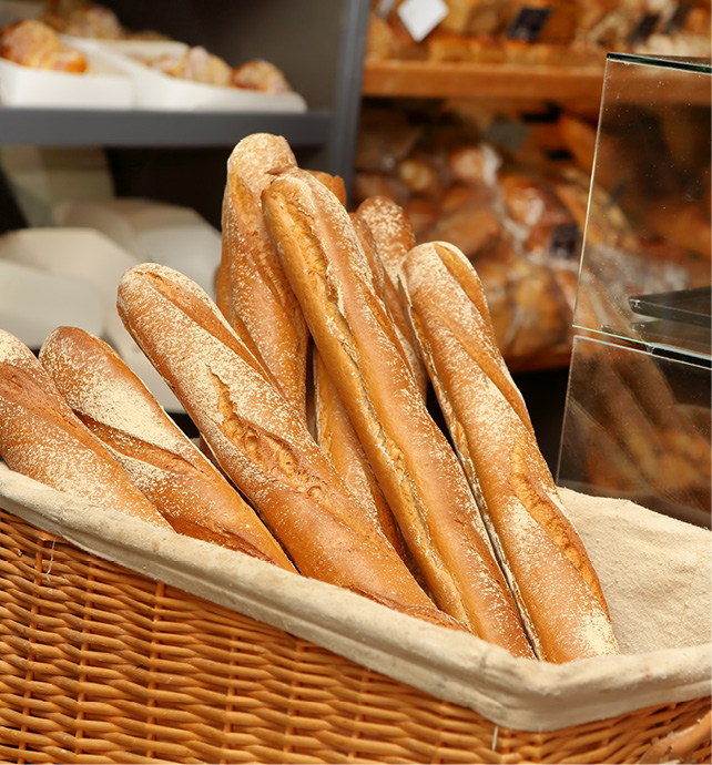 Fresh baguettes and other French treats in bakery 